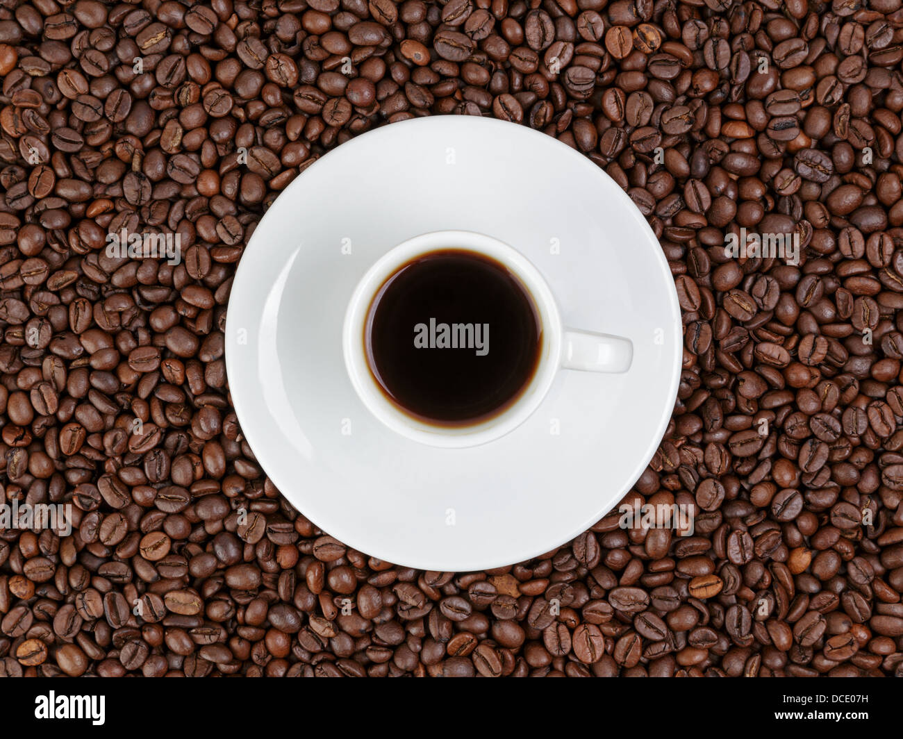 one cup of coffee in coffee beans Stock Photo Alamy
