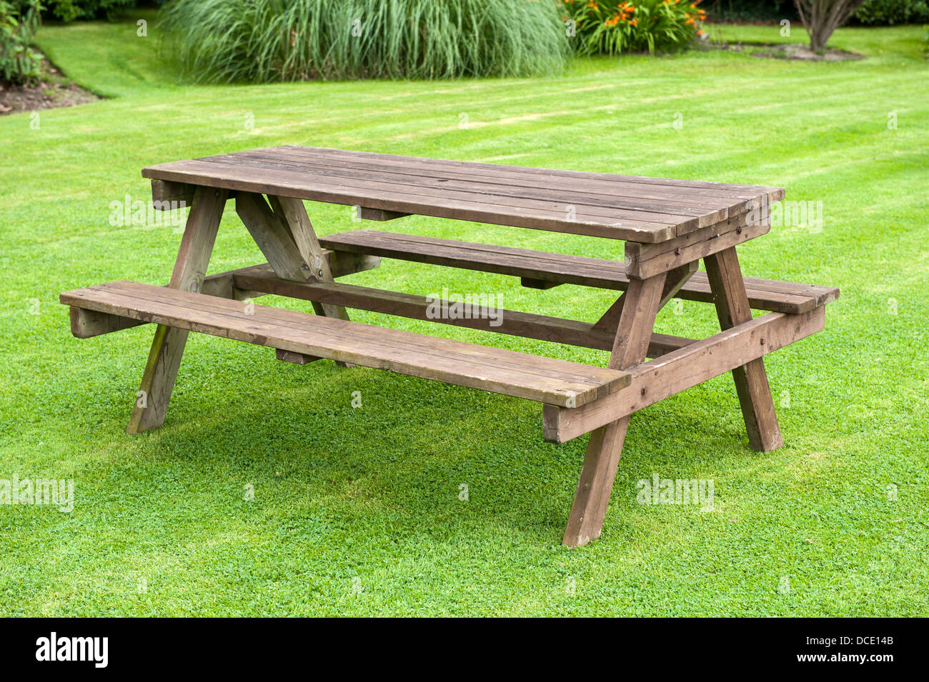 picnic or garden bench on a lawn Stock Photo