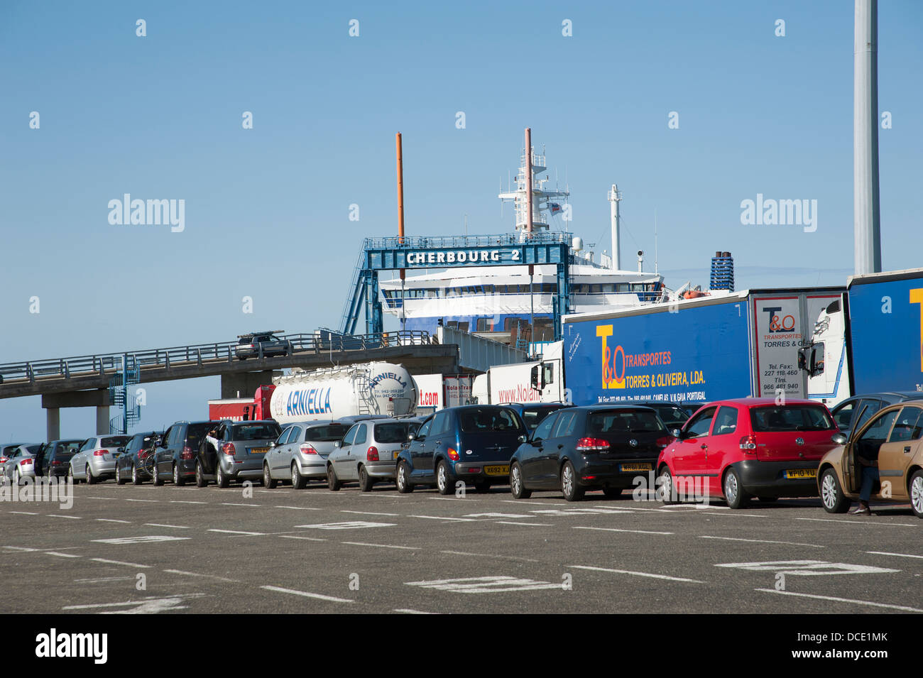 Cars and lorries wait to load onto a cross channel ferry at Normandy Cherbourg France Stock