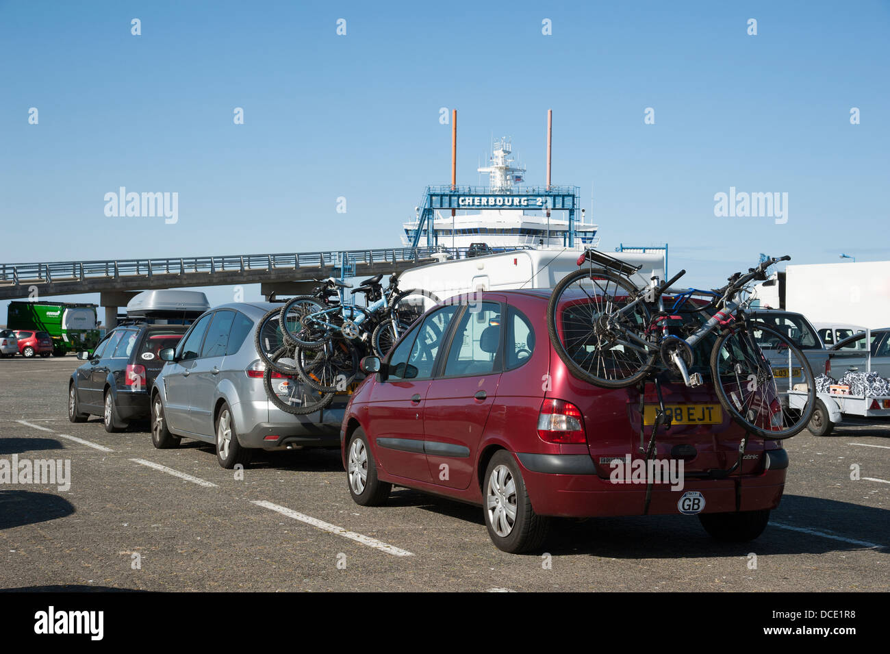 Bicycles on car cycle racks wait to load onto cross channel ferry at Cherbourg Normandy France Stock Photo