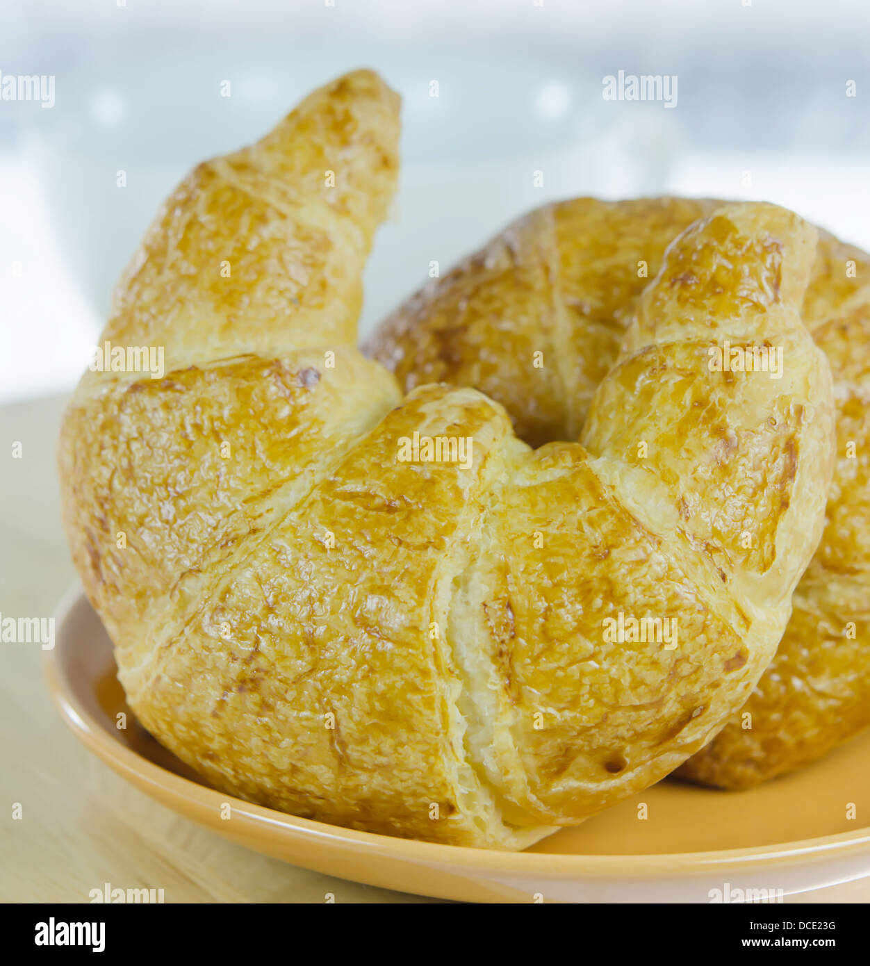 close up fresh croissants on brown dish Stock Photo