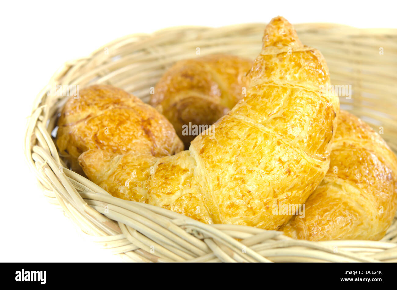close up croissants in wooden basket Stock Photo