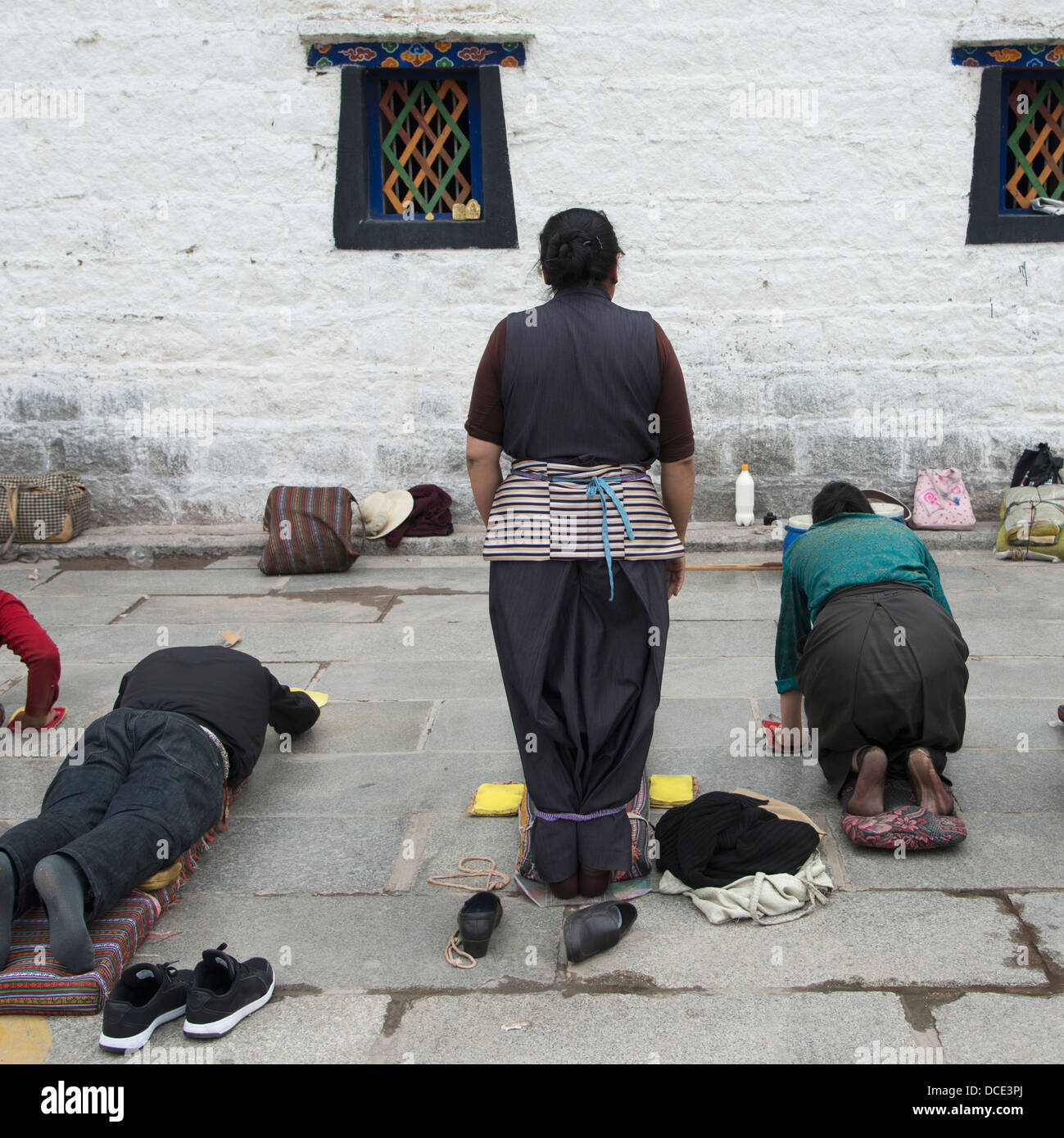 Buddhists Kneeling and Laying Down in Prayer and Meditation; Lhasa ...