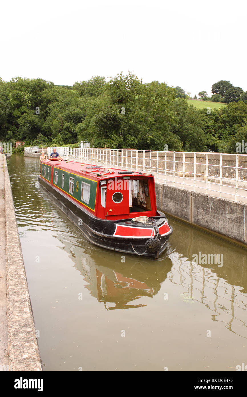 Avoncliff aqueduct a narrow boat on the Kennet and Avon canal between Limpley Stoke and Bradford On Avon England UK Stock Photo