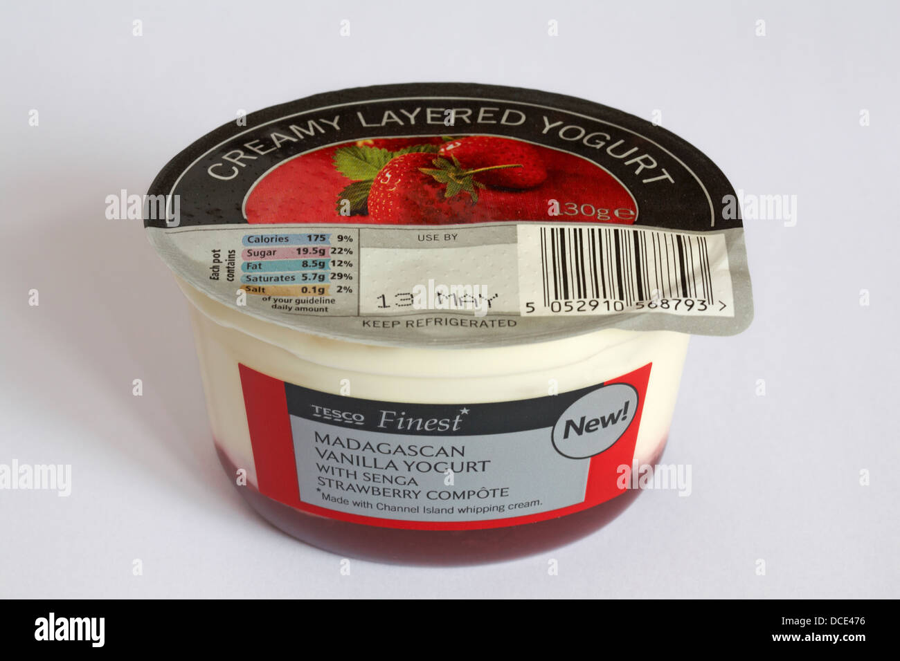 Tesco Finest creamy layered yogurt Madagascan vanilla yogurt with senga strawberry compote isolated on white background Stock Photo