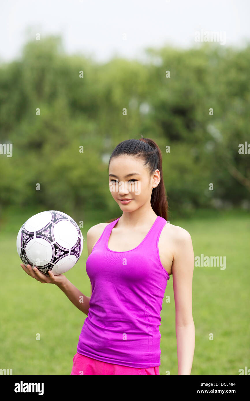 Young woman holding a basketball Stock Photo - Alamy