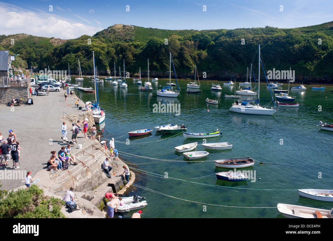 People on quay quayside harbour Solva Pembrokeshire West Wales UK Stock Photo