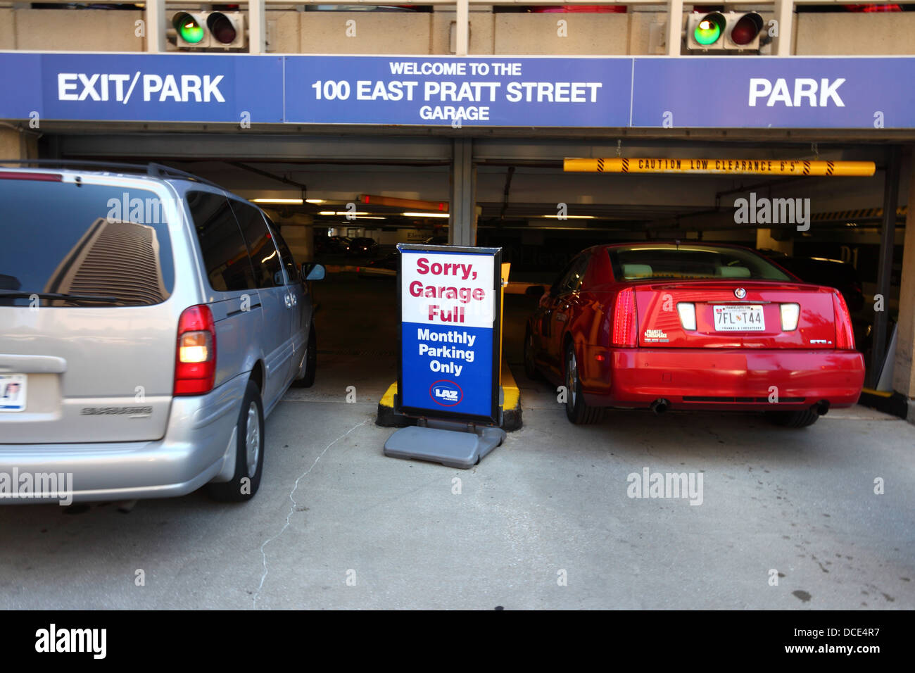Garage full sign and cars waiting outside garage at 100 East Pratt Street, Baltimore City, Maryland, USA Stock Photo