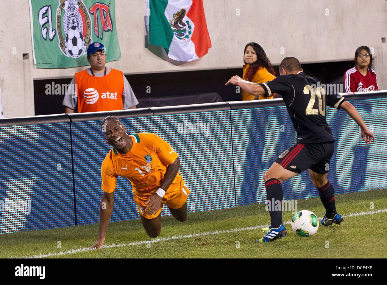 East Rutherford, New Jersey, USA. 14th Aug, 2013. August 14, 2013: Ivory Coast forward Didier Drogba (11) falls to the ground and screams in frustration as Mexico defender Jorge Torres Nilo (20) settles the ball during the International friendly match between Mexico and Ivory Coast at Met Life Stadium, East Rutherford, NJ. Mexico defeated Ivory Coast 4-1. © csm/Alamy Live News Stock Photo