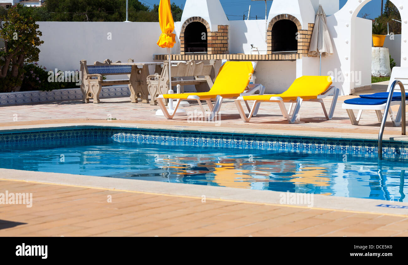 Beautiful swimming pool in hotel in sunny day Stock Photo - Alamy