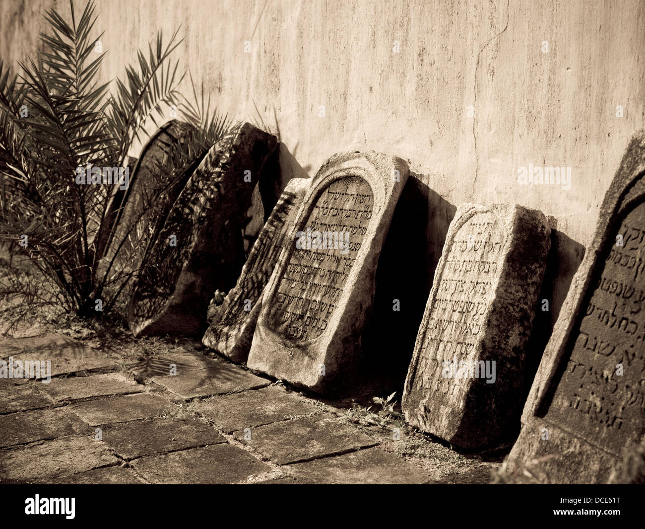 Jewtown,Cochin,Kerala,India;Gravestones Leaning Against A Synagogue Stock Photo