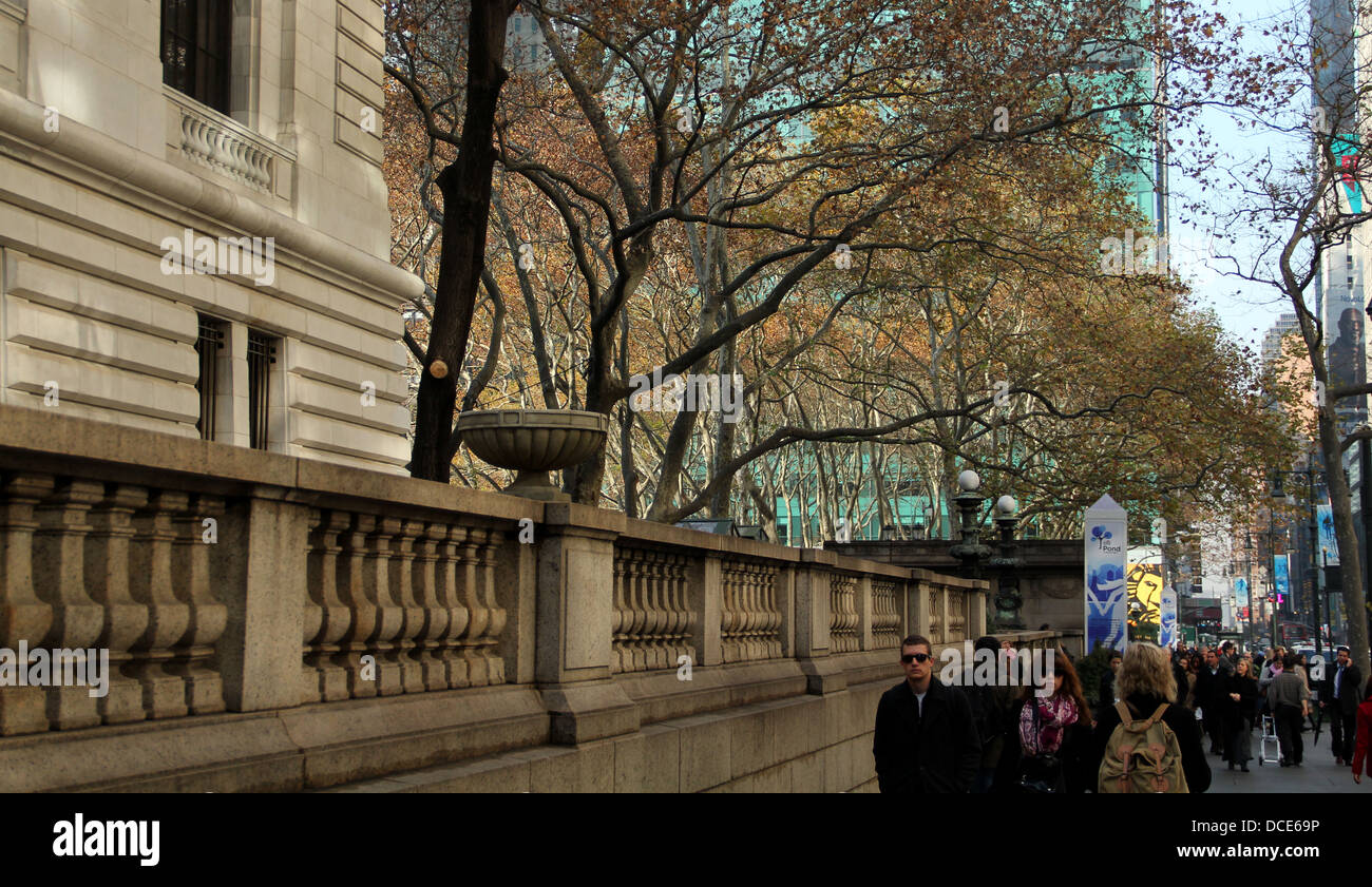 fall trees flourish on sidewalk bordering bryant park, nyc Stock Photo ...