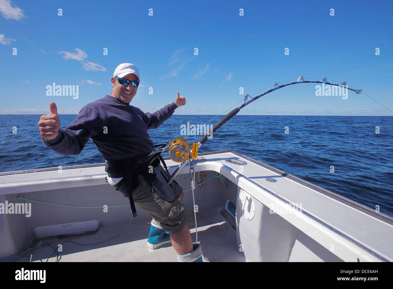Man on a boat fishing in the atlantic ocean; prince edward island canada  Stock Photo - Alamy