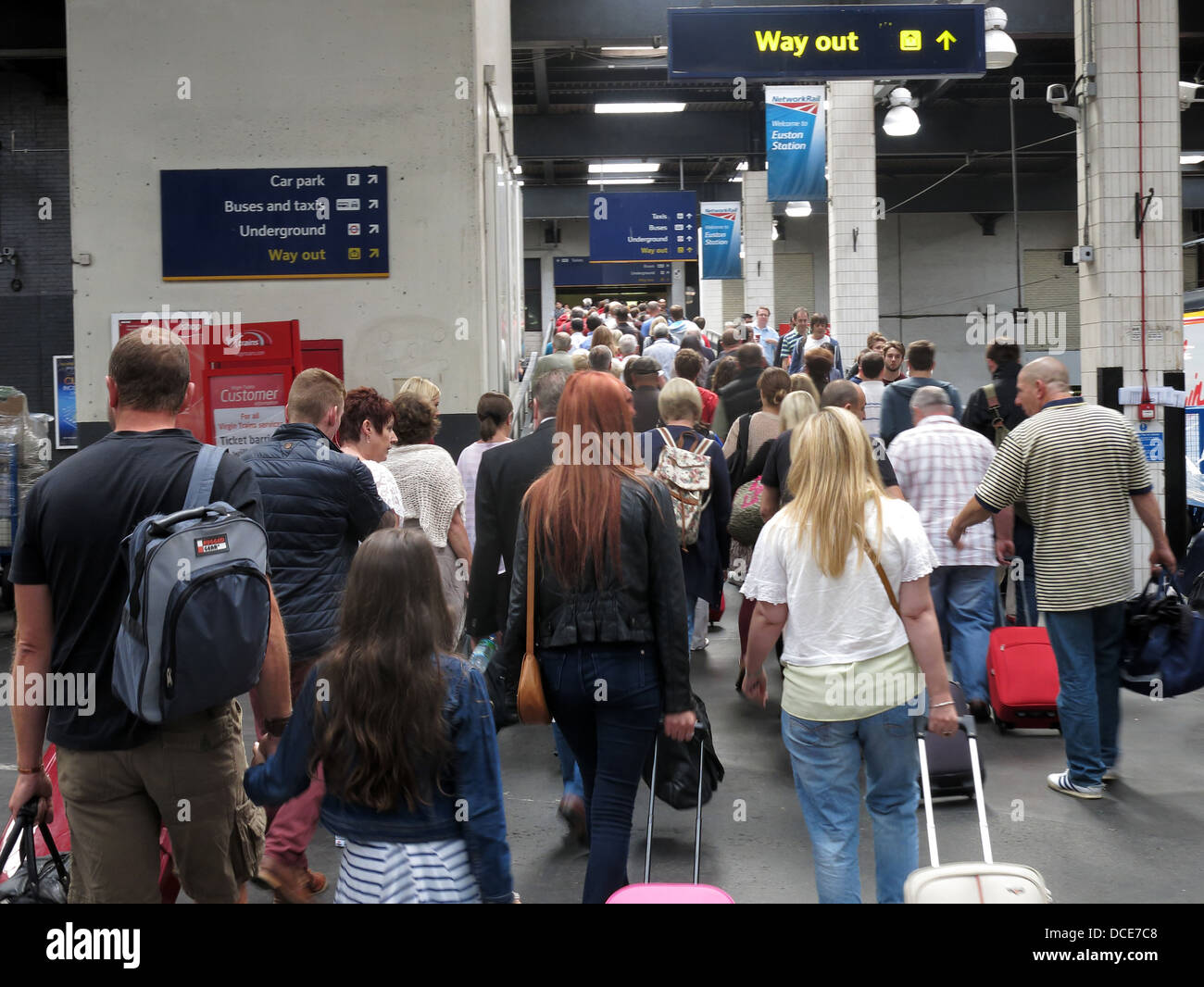 Passengers leaving platform at London Euston Mainline railway station Stock Photo