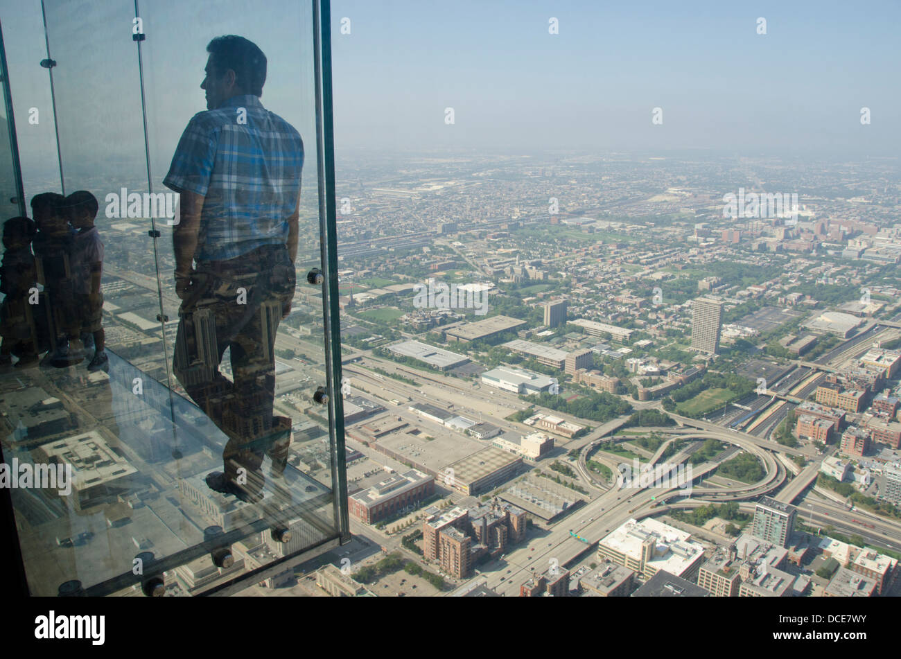 Illinois, Chicago, Willis Tower (aka Sears Tower). Tourists out on the 'Ledge' on Sky Deck Chicago, 103 floors up. Stock Photo