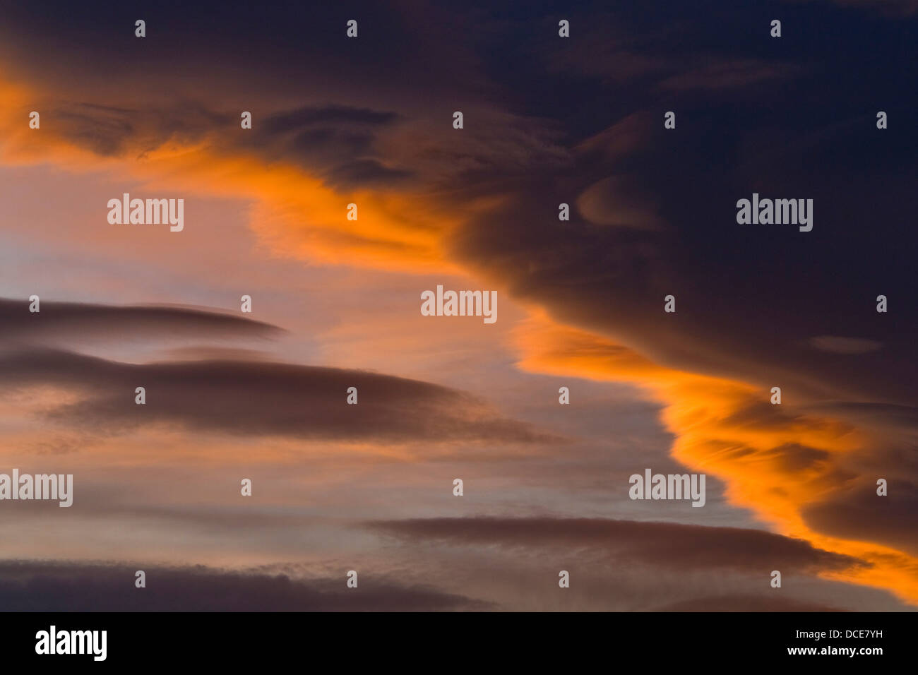 Sunset light on lenticular storm clouds, California Stock Photo