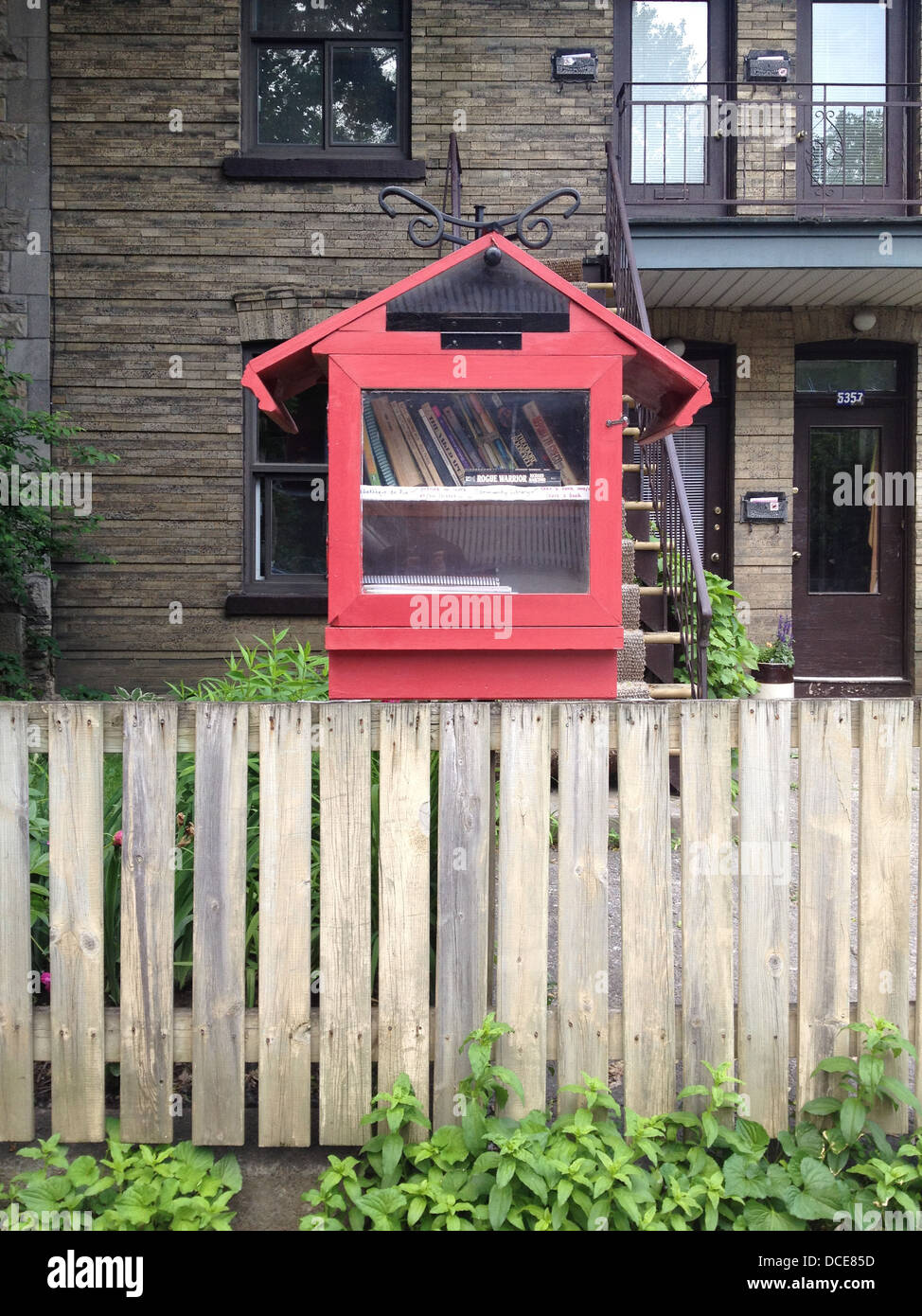 Little free library - Take a book, bring a book - encourages literacy & reading- In the Mile End district of Montreal Canada Stock Photo