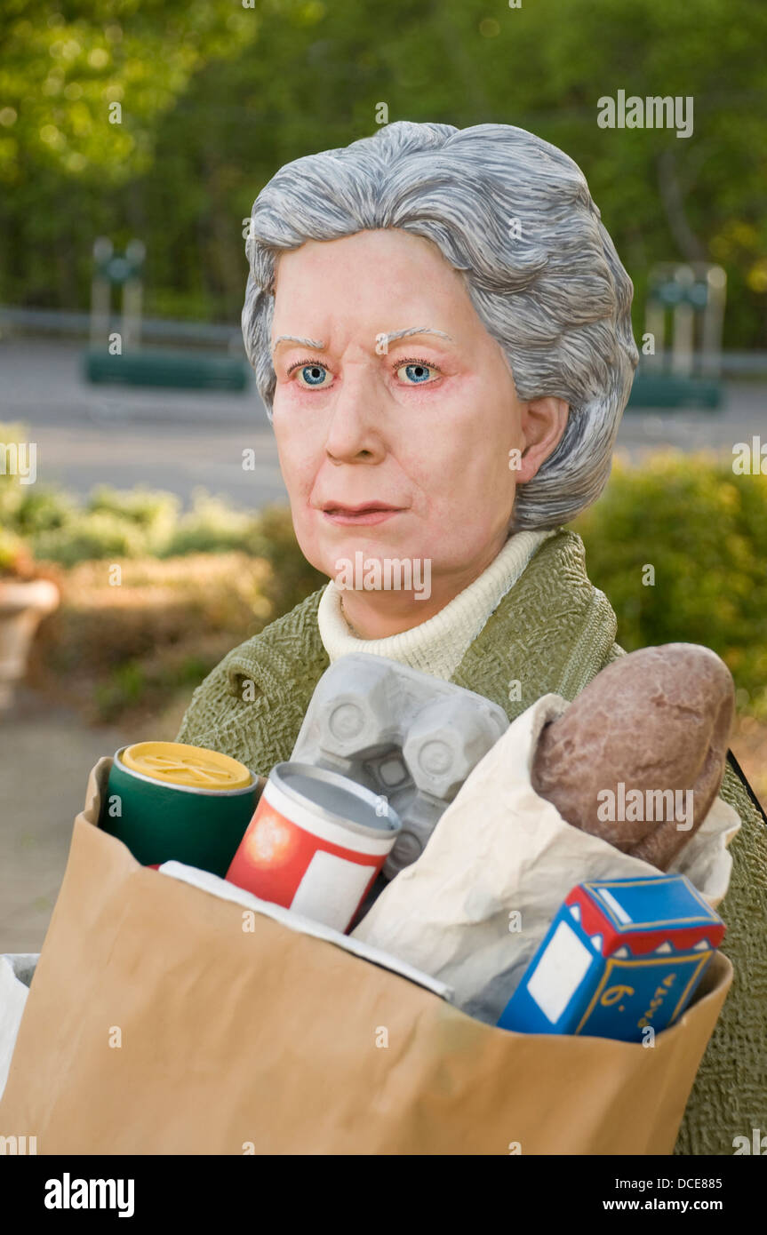 Sculpture of an elderly woman called 'Holding Out' by J. Seward Johnson ©1987 Stock Photo