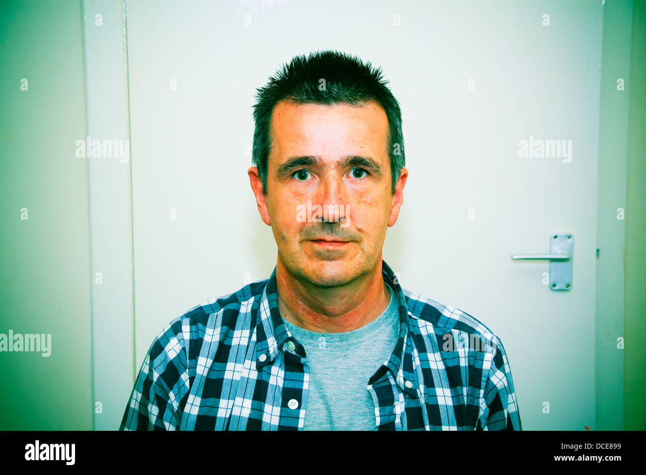 Portrait of slightly startled looking middle aged man Stock Photo