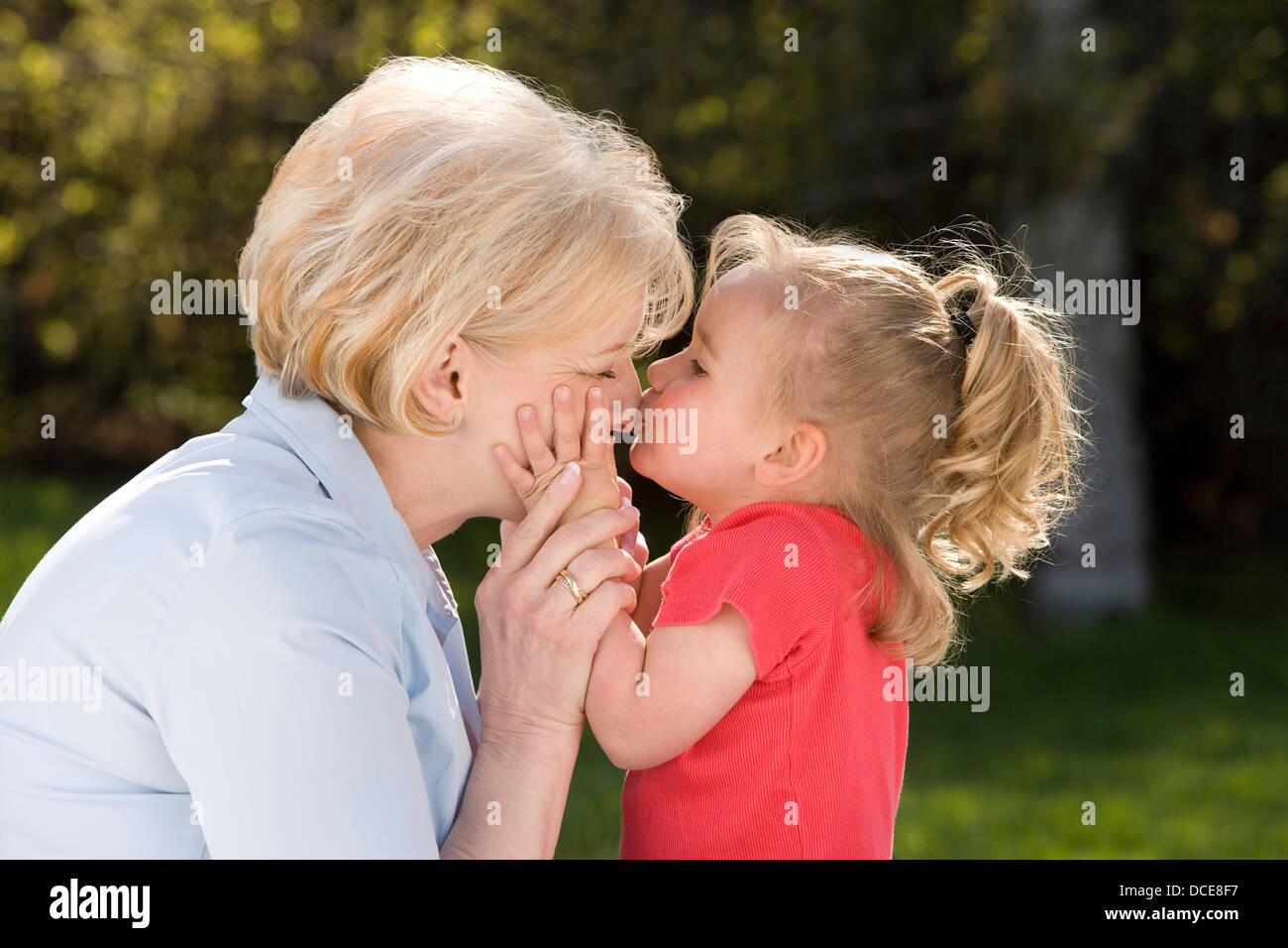 Outdoor Portrait Of Grandmother And Grandbabe Kissing Stock Photo Alamy