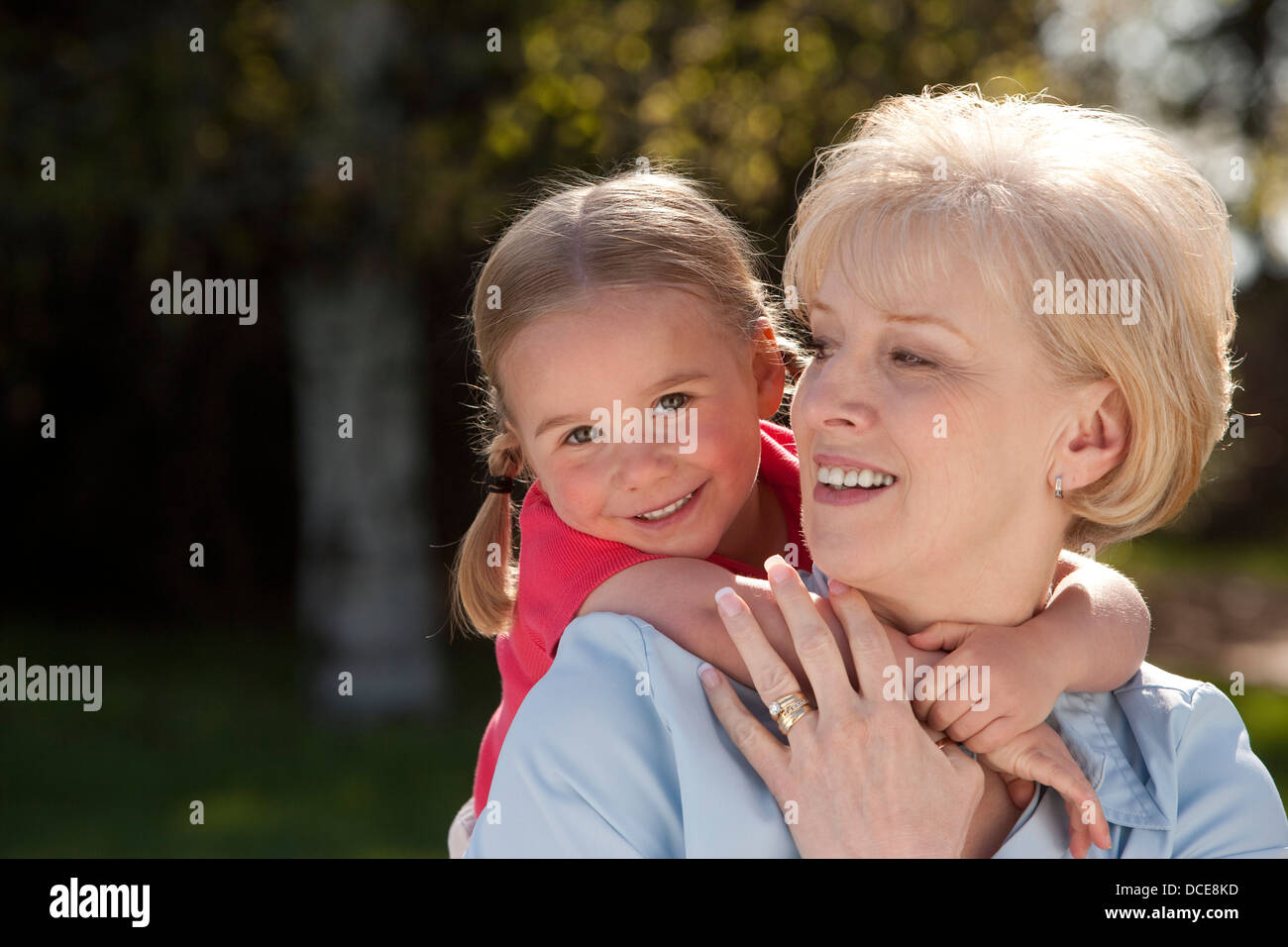 Portrait Of Grandmother And Granddaughter Outdoors Stock Photo