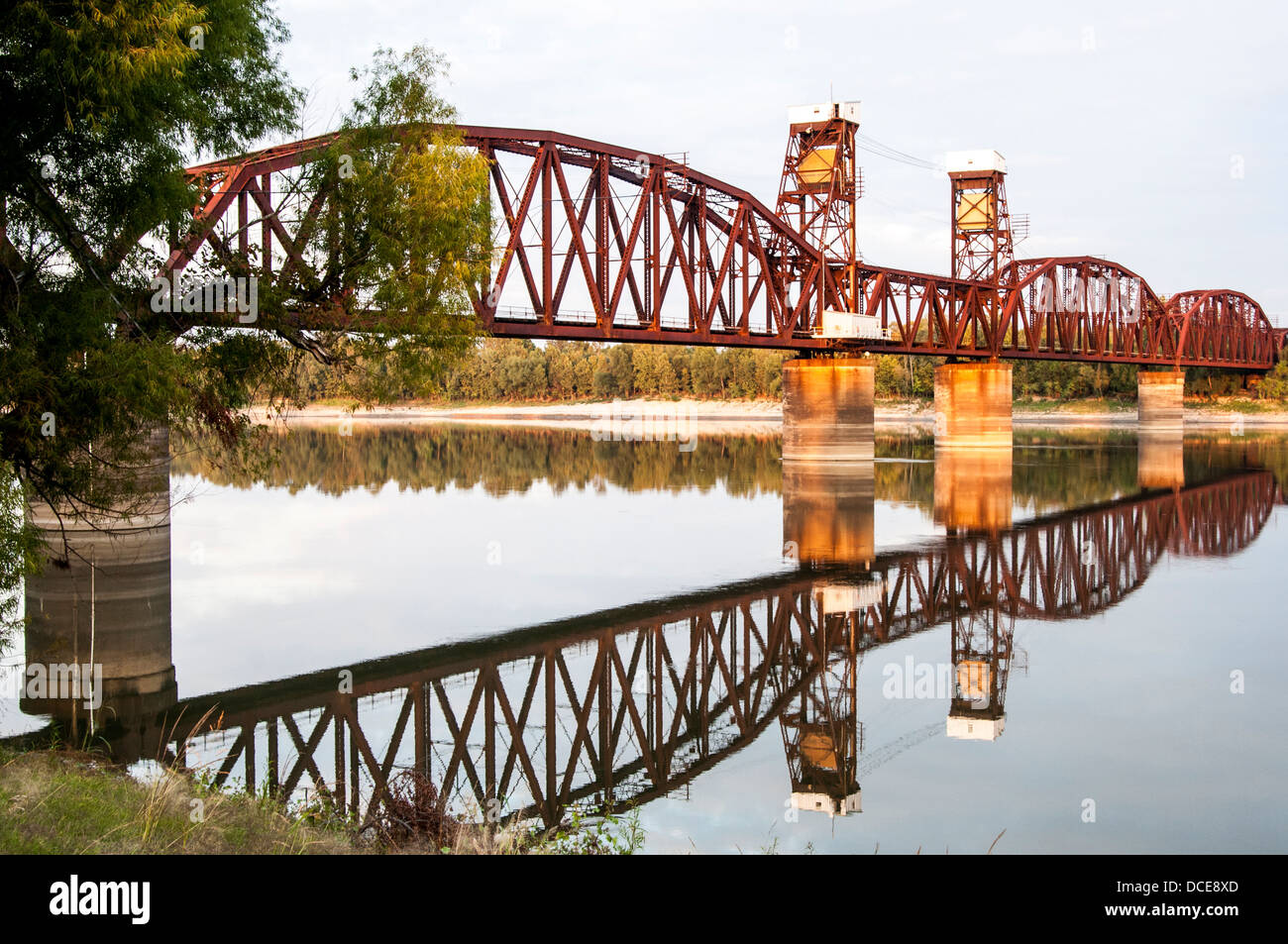 USA, Louisiana, Melville, Atchafalaya Basin, Railroad Bridge crossing the Atchafalaya River with reflection, north of I-10. Stock Photo