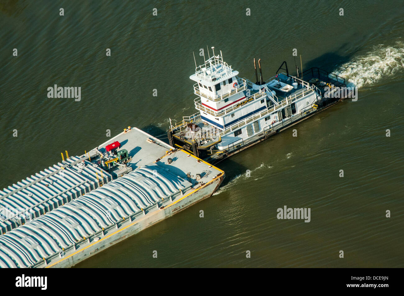 USA, Louisiana, Atchafalaya Basin area, Intracoastal Waterway west of Morgan City, westward-bound tugboat pushing freight barge. Stock Photo