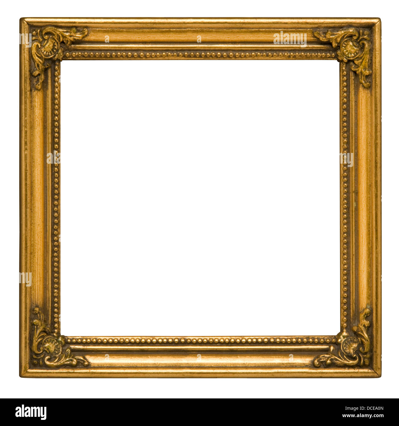 Antique square picture frame painted gold against white background Stock Photo