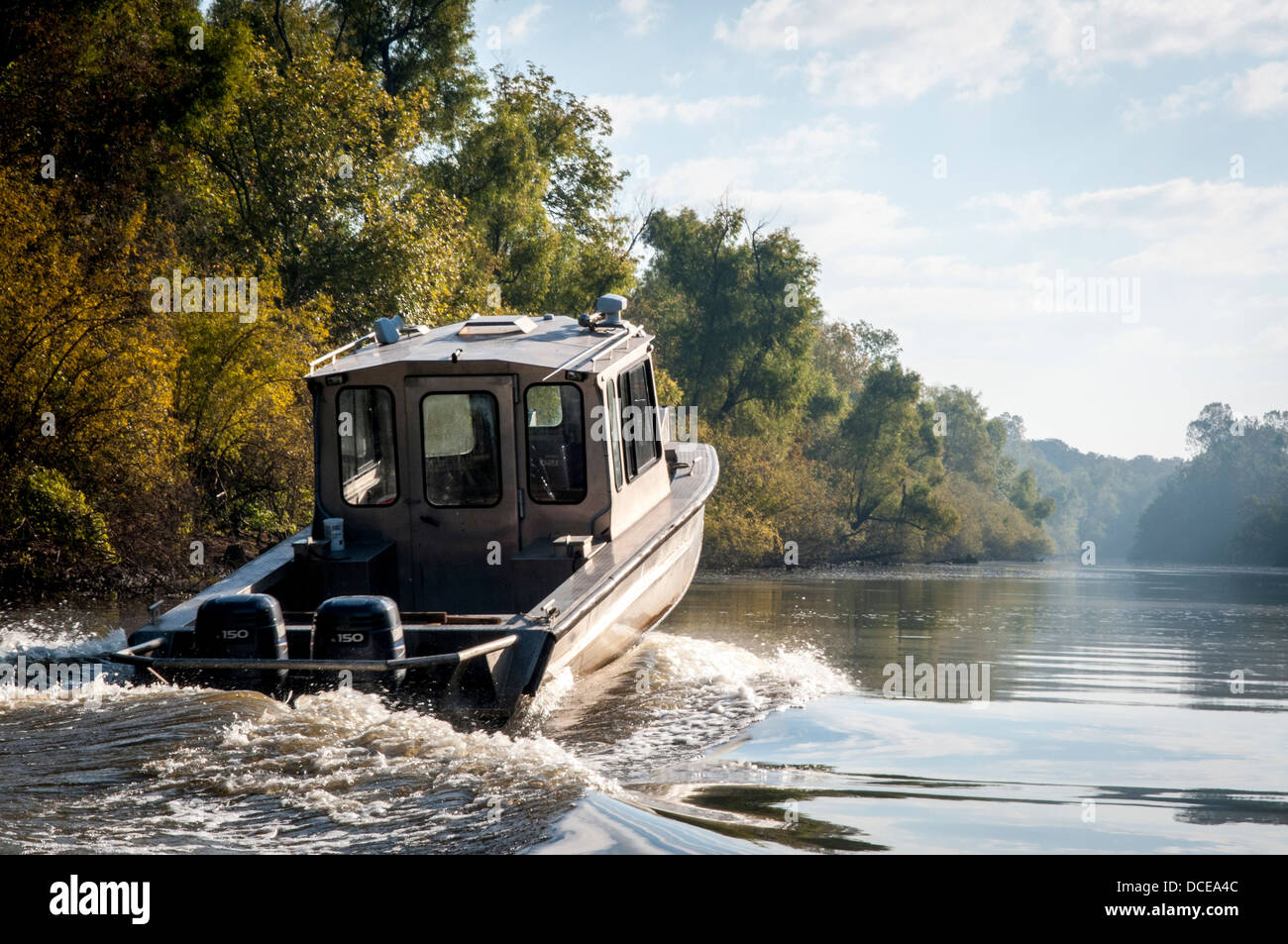 USA, Louisiana, Atchafalaya Basin, fishing boat on river motoring past