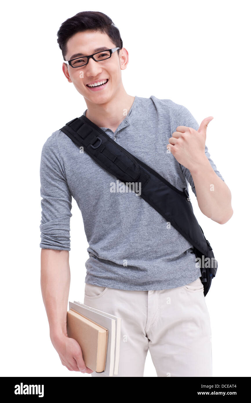 Cheerful male college student doing thumbs up Stock Photo - Alamy