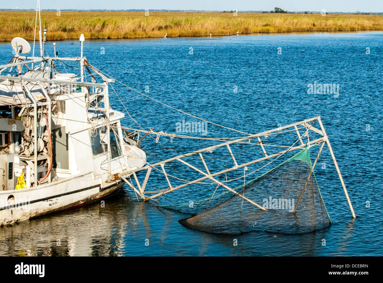 USA, Louisiana, Atchafalaya Basin, shrimping boat going out to Terrabonne Bay via the Petit Caillou Bayou, south of Dulac. Stock Photo