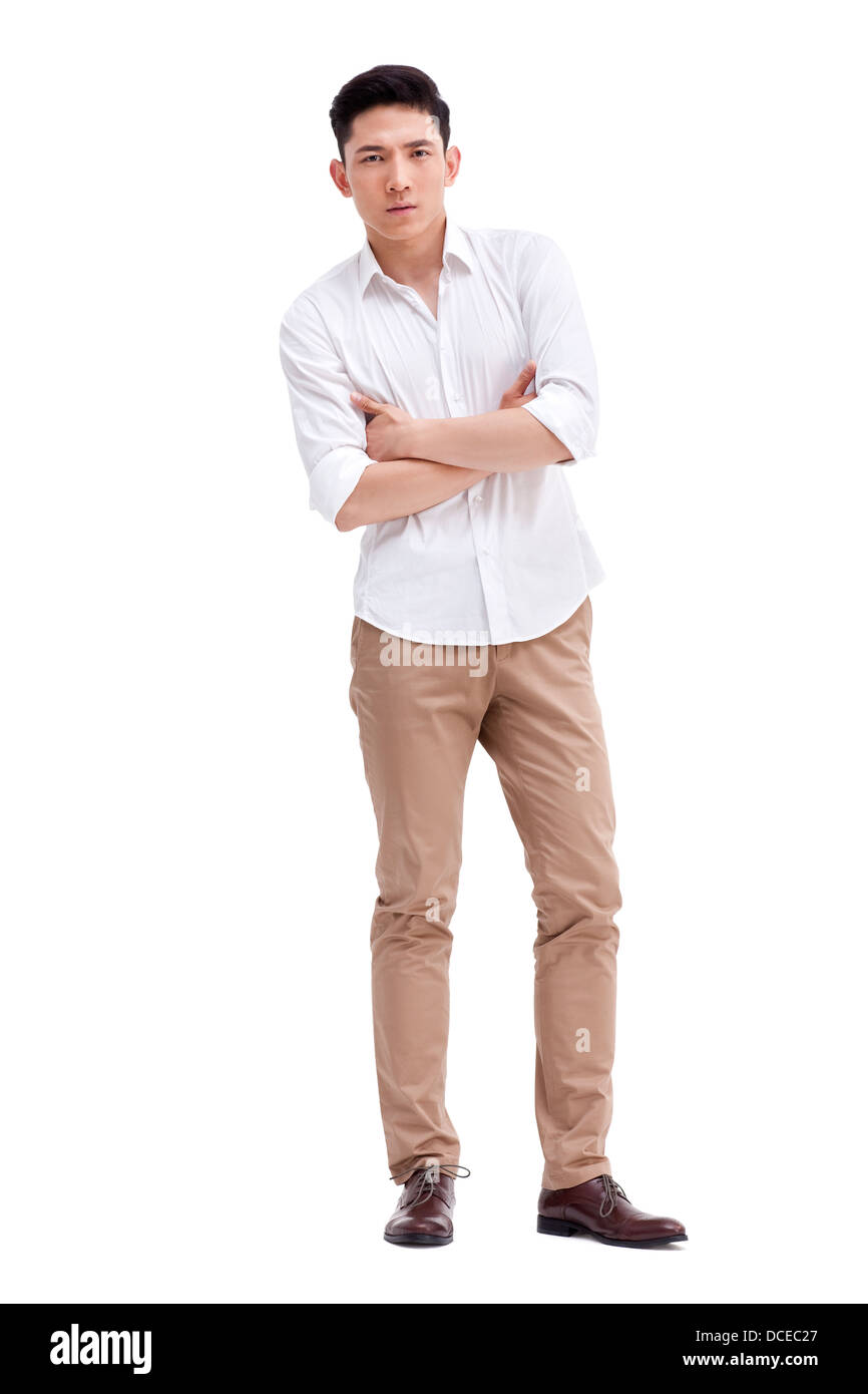 Cool young man with arms crossed Stock Photo - Alamy