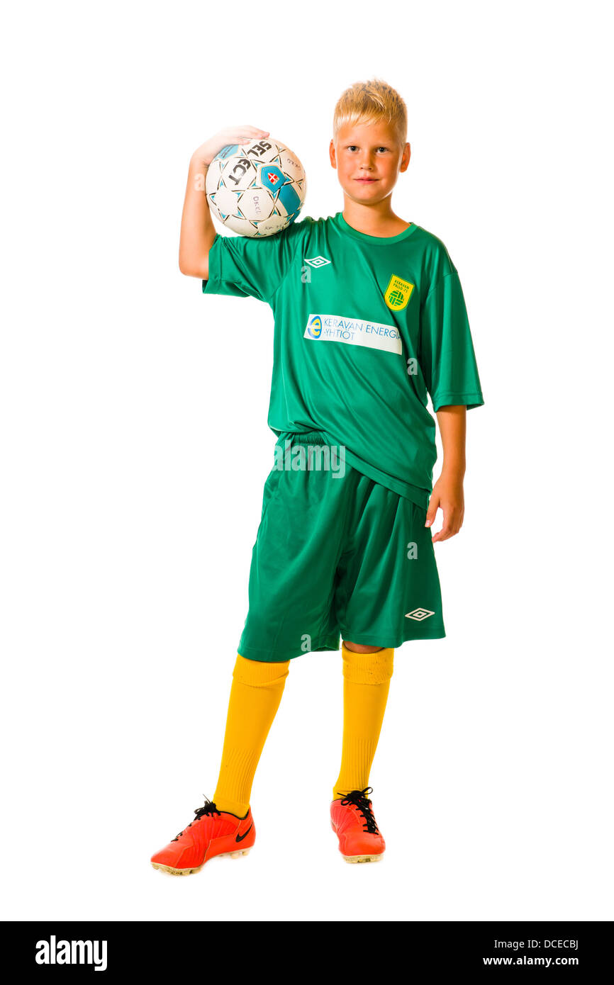 Young football player wearing green team uniform, studio shot, white