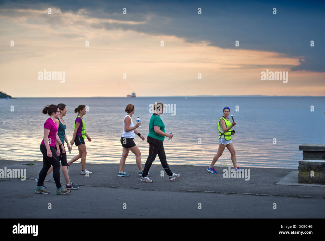 A womens fitness group training in the evening at Portishead, North Somerset UK Stock Photo