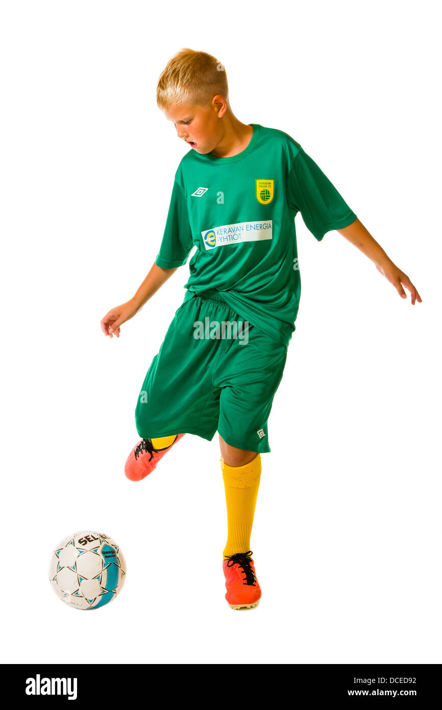 Young football player wearing green team uniform, studio shot, white background Stock Photo Alamy