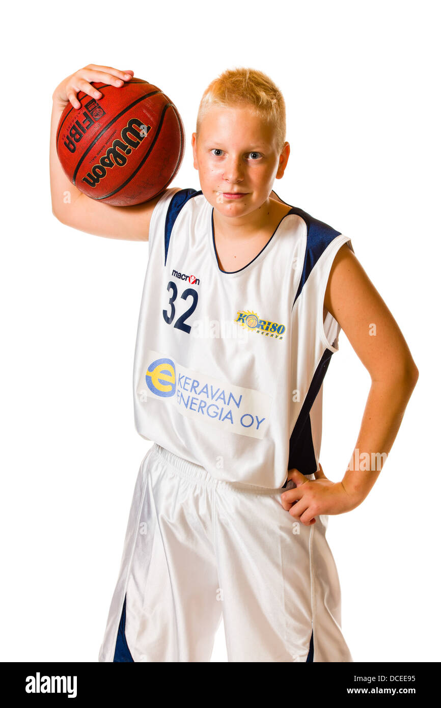 Young basketball player wearing white team uniform, studio shot, white background Stock Photo