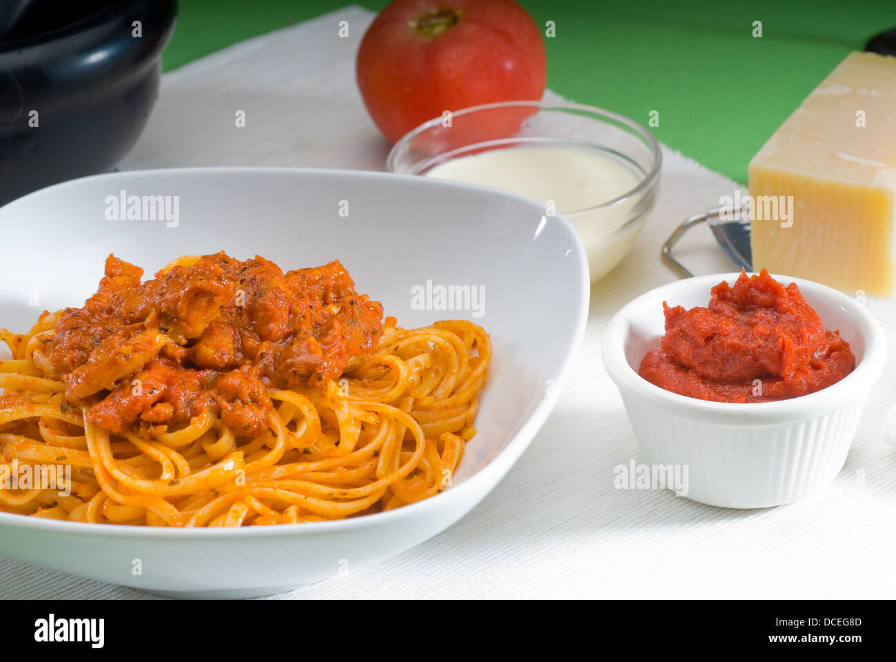 A delicious plate of rustic tomato and chicken pasta garnished with herbs