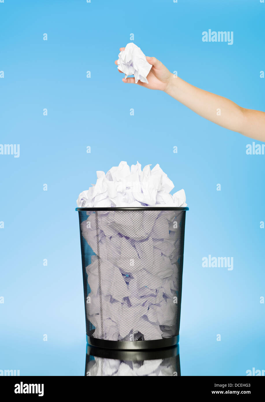 trowing a paper to a wastebasket Stock Photo Alamy