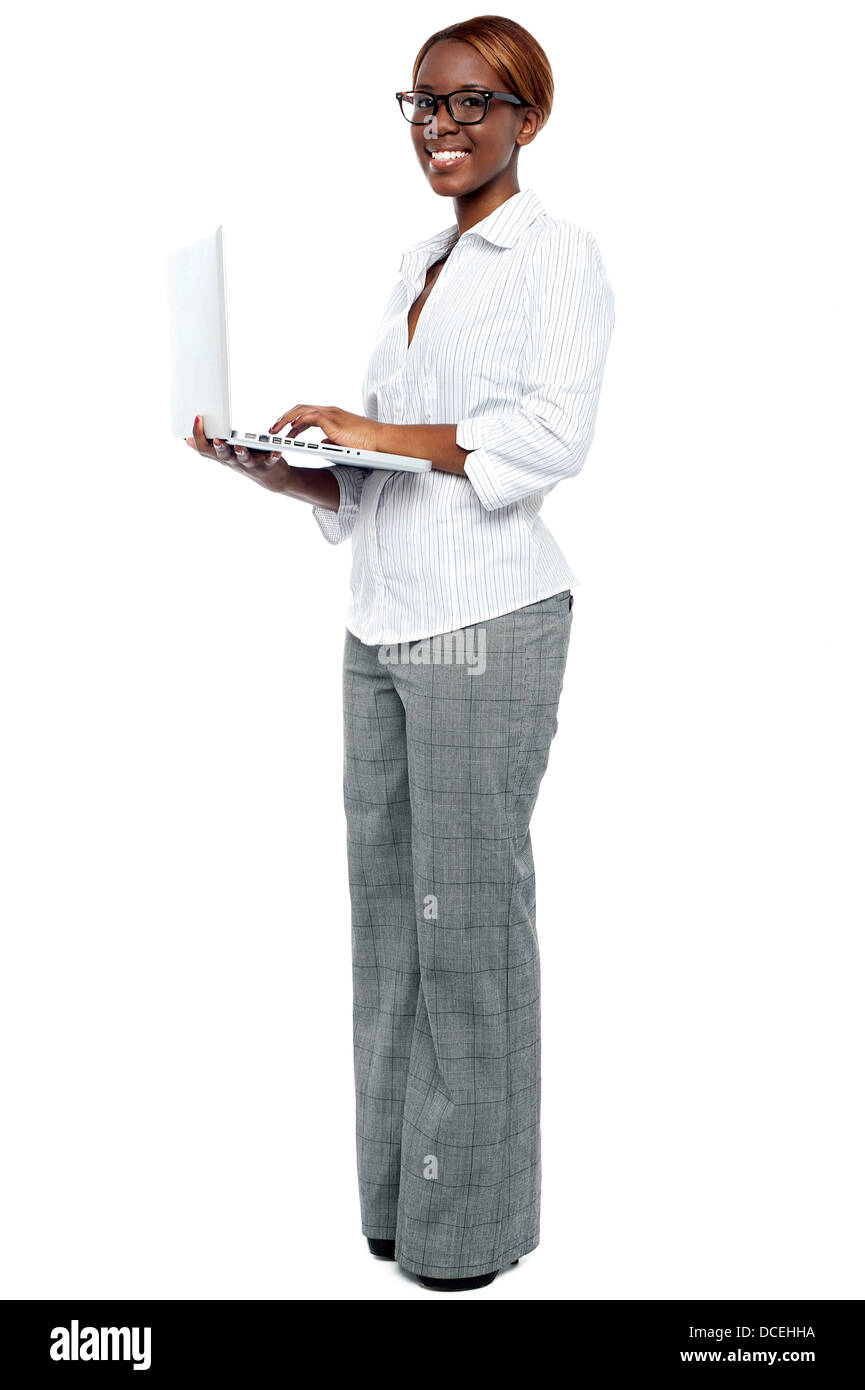 African businesswoman working on laptop. Full length portrait Stock ...