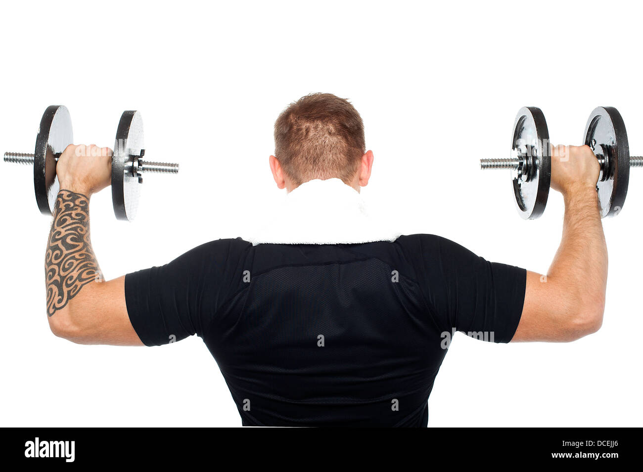 Back pose of male bodybuilder lifting weights isolated over white background Stock Photo