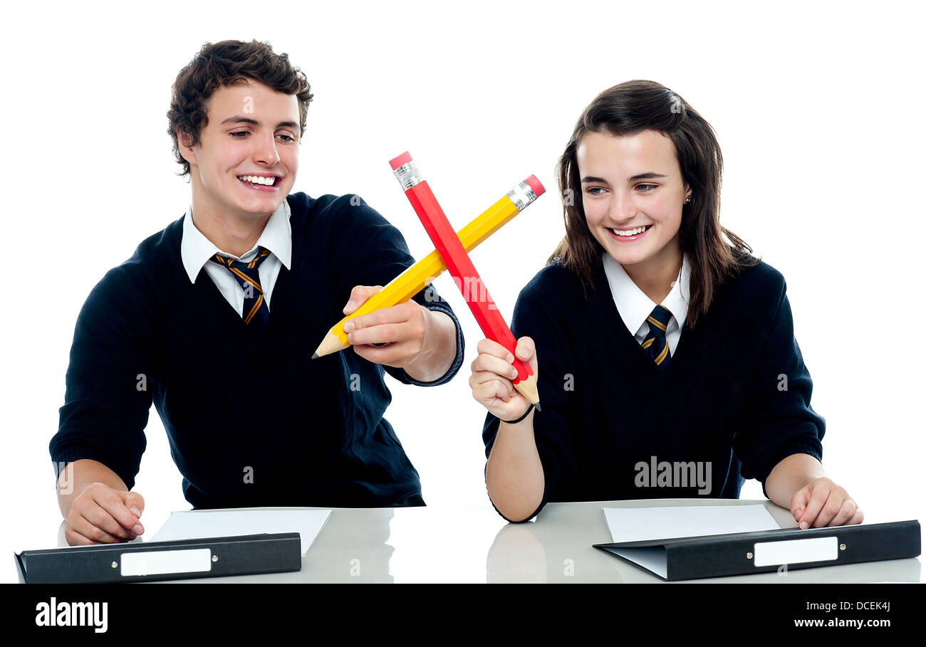 Classmates engaged in a mock fight after completing the test Stock Photo