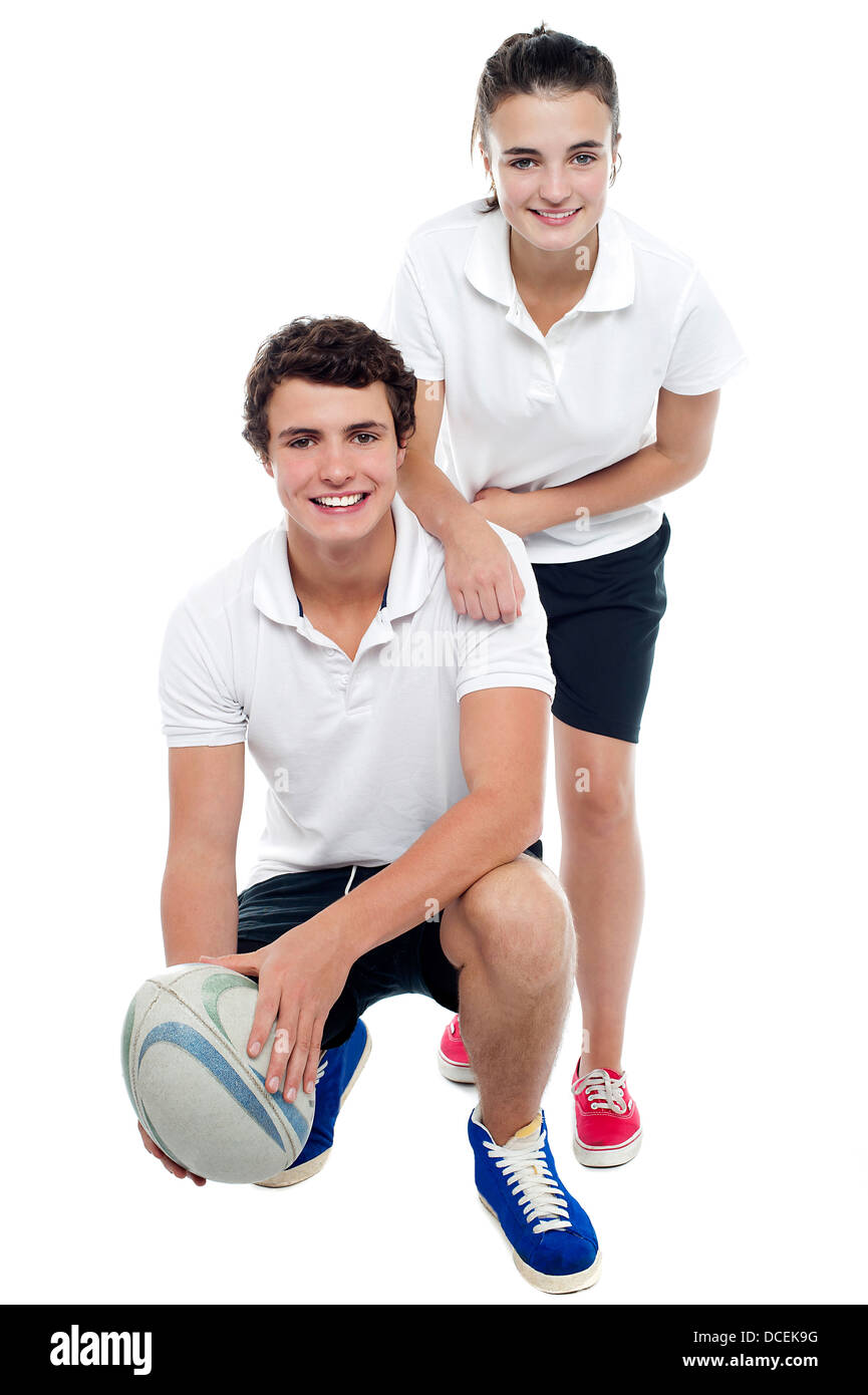 Charming football team players in sports attire isolated against white