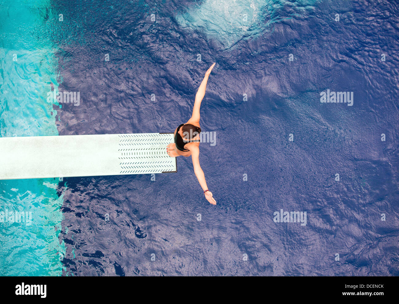 high diver jumping into the water Stock Photo Alamy