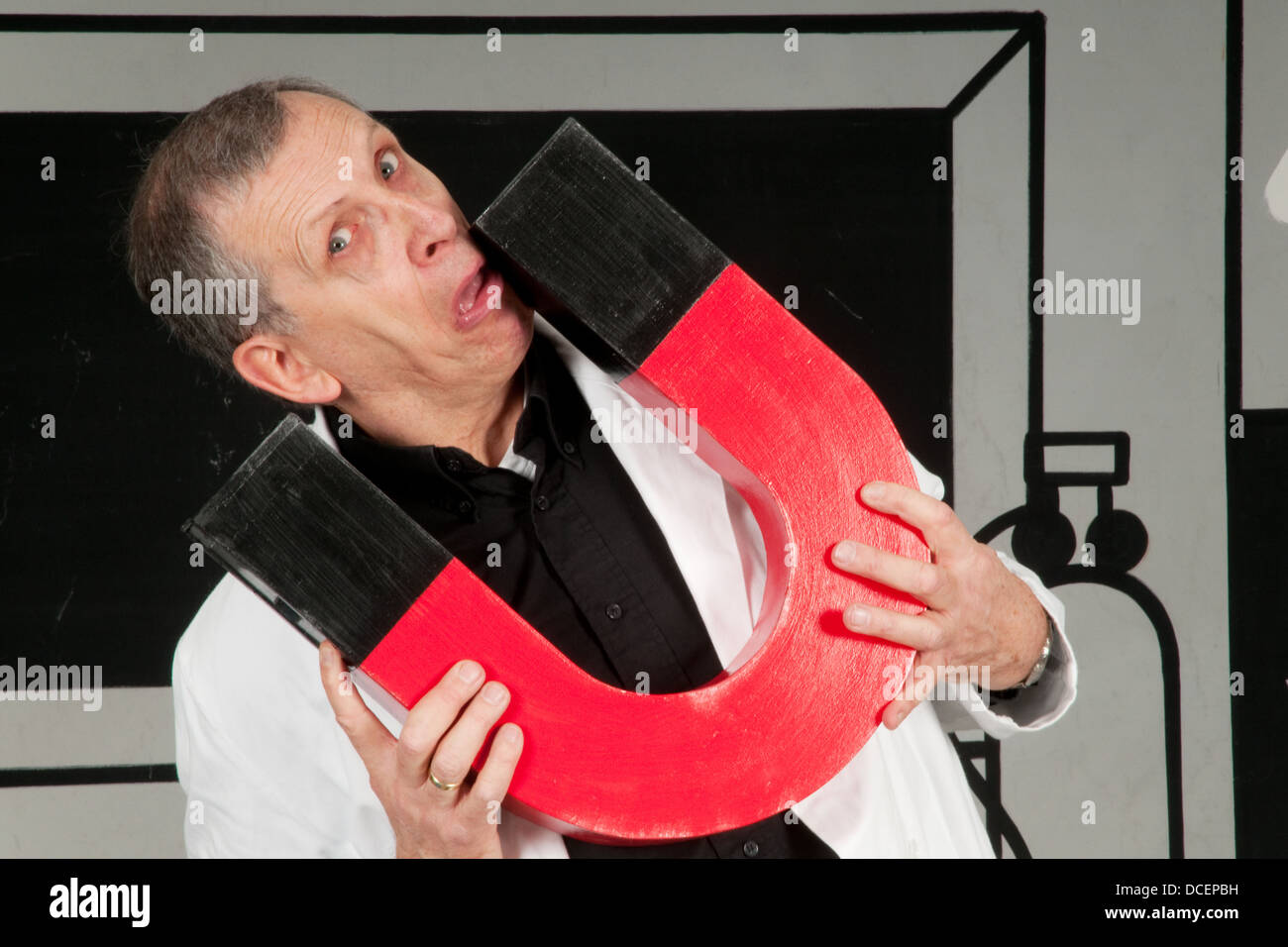 Professor is testing magnetism Stock Photo