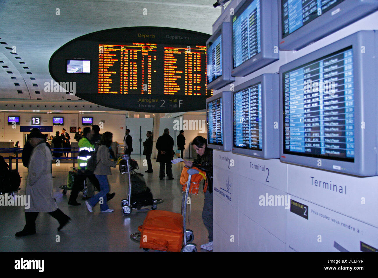 Air travelers at busy airport terminal of Roissy Charles de Gaulle