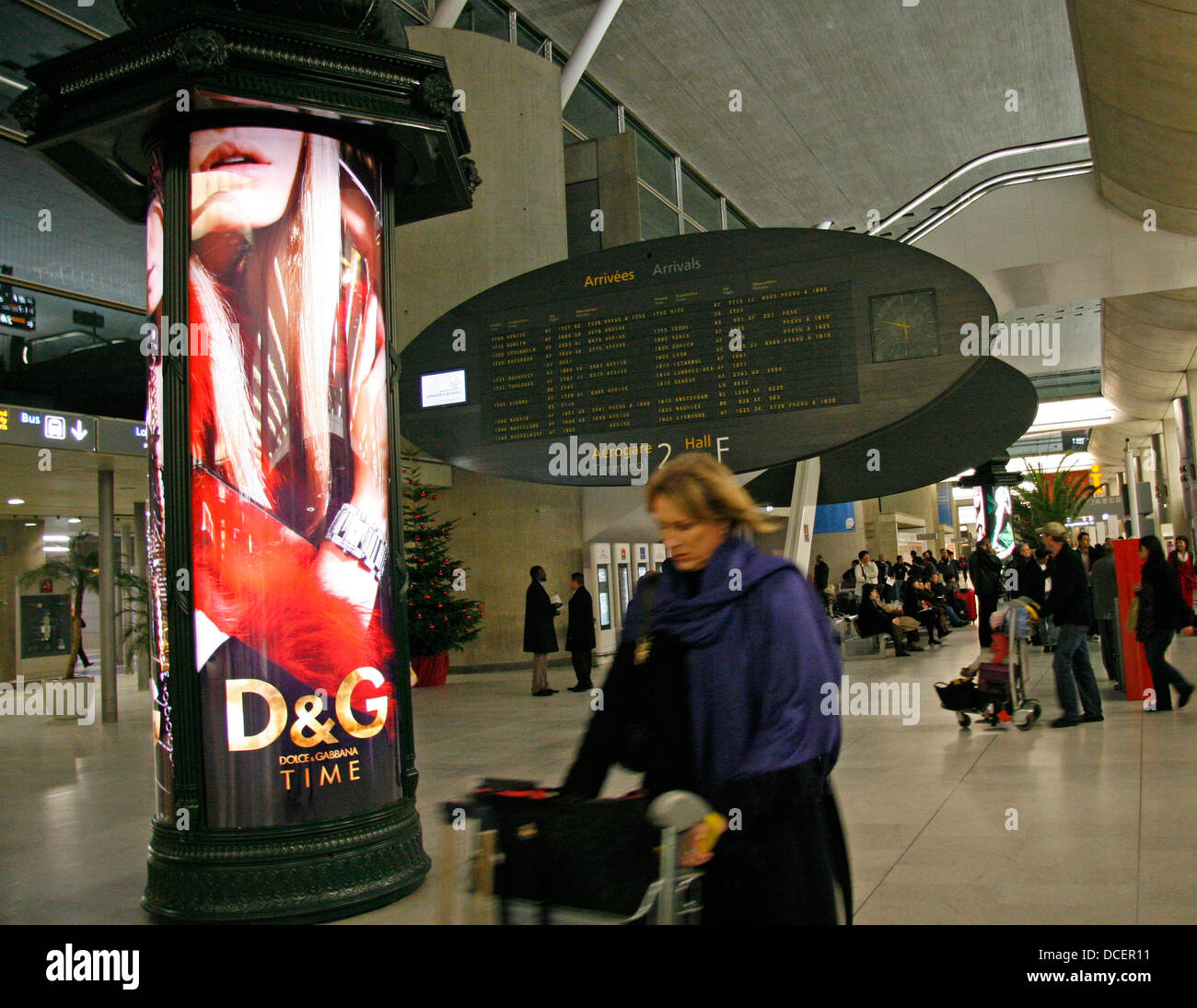Air travelers at busy airport terminal of Roissy Charles de Gaulle