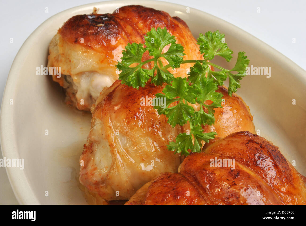 roasted chicken olive in a white bowl Stock Photo Alamy