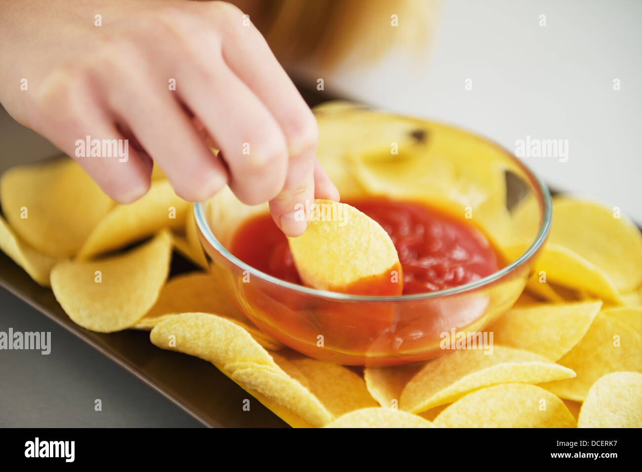 Closeup On Girl Putting Chips In Sauce Stock Photo Alamy closeup-on-girl-putting-chips-in-sauce-stock-photo-alamy
