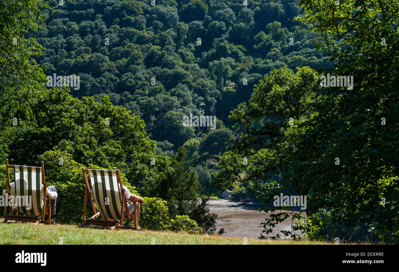 Galmpton Devon England. July 27th 2013. Tow men sit in deck chairs on a