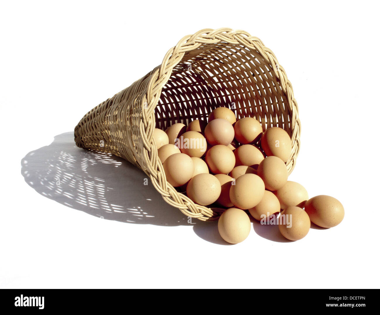 A depiction of the saying with a bunch of eggs in a cone shaped wicker